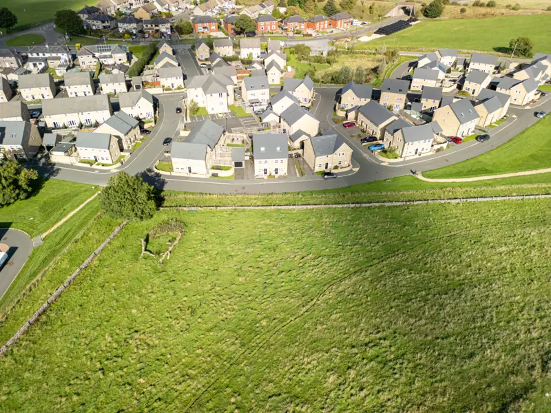 Aerial view of Harpur Hill with moorland beyond